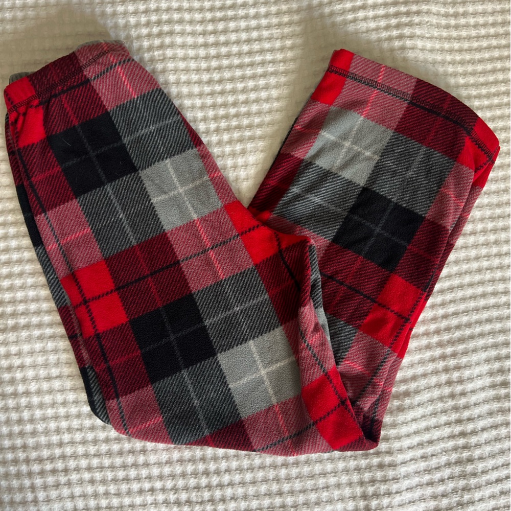 STEVE brand boy’s red, black and grey plaid pajama bottoms.